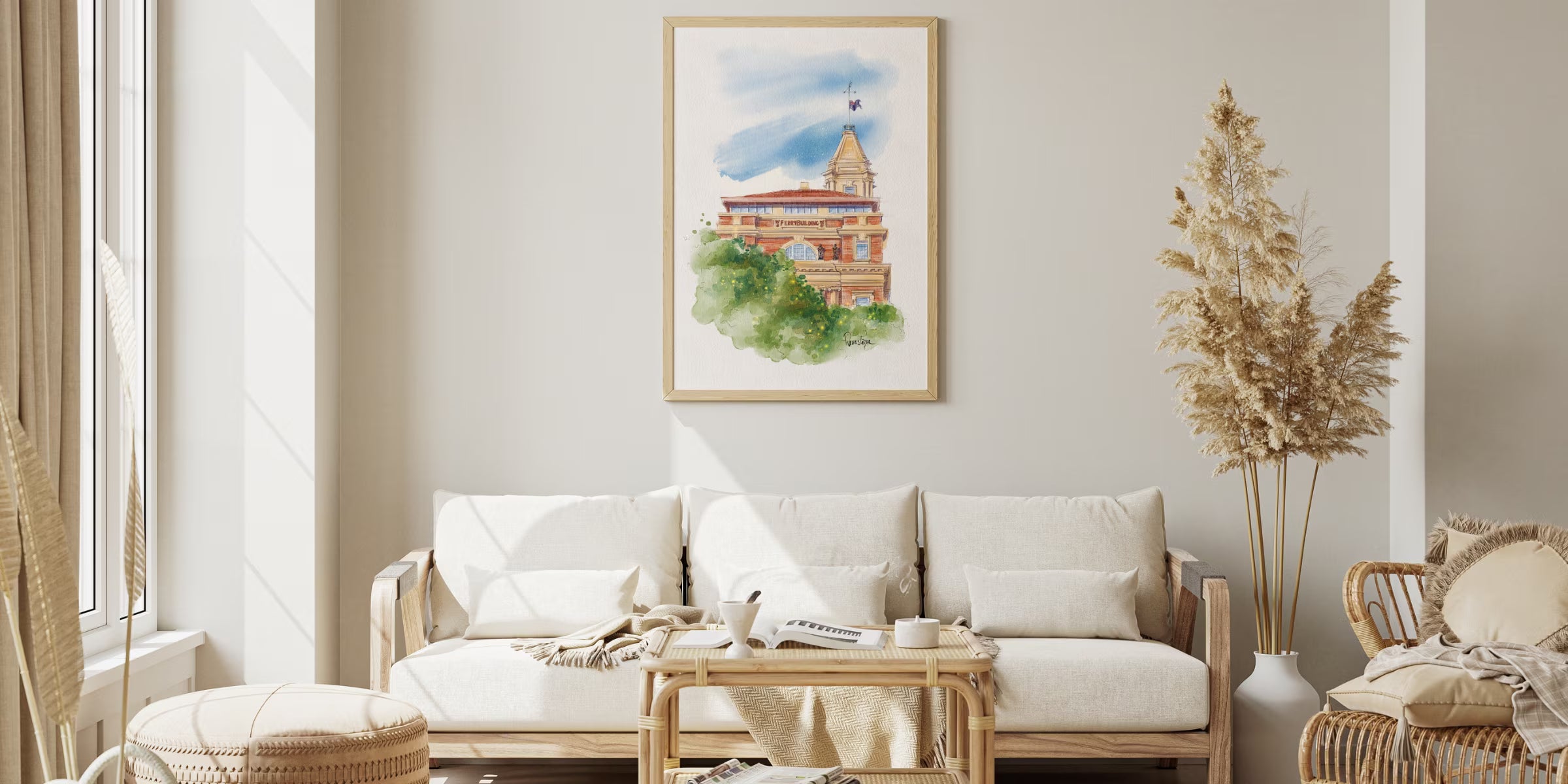 Modern living room with framed art print by Revastique, white sofa, wooden coffee table and minimalist home decor on wall